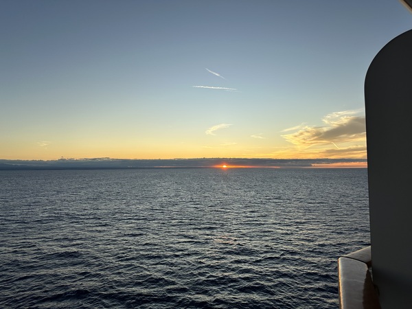 Cruise ship sailing into the sunset